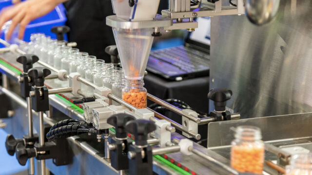 A photograph of a pharmaceutical production line.