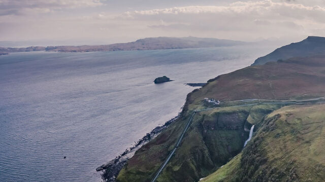 A photograph of an aerial view of the side of a cliff.