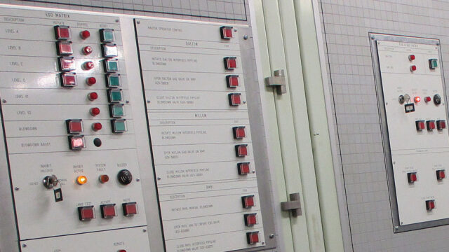 A photograph of a control panel with different coloured buttons.