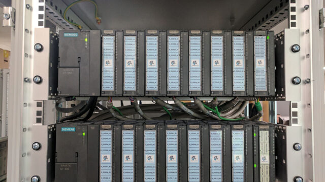 A photograph of several rows of Siemens servers.
